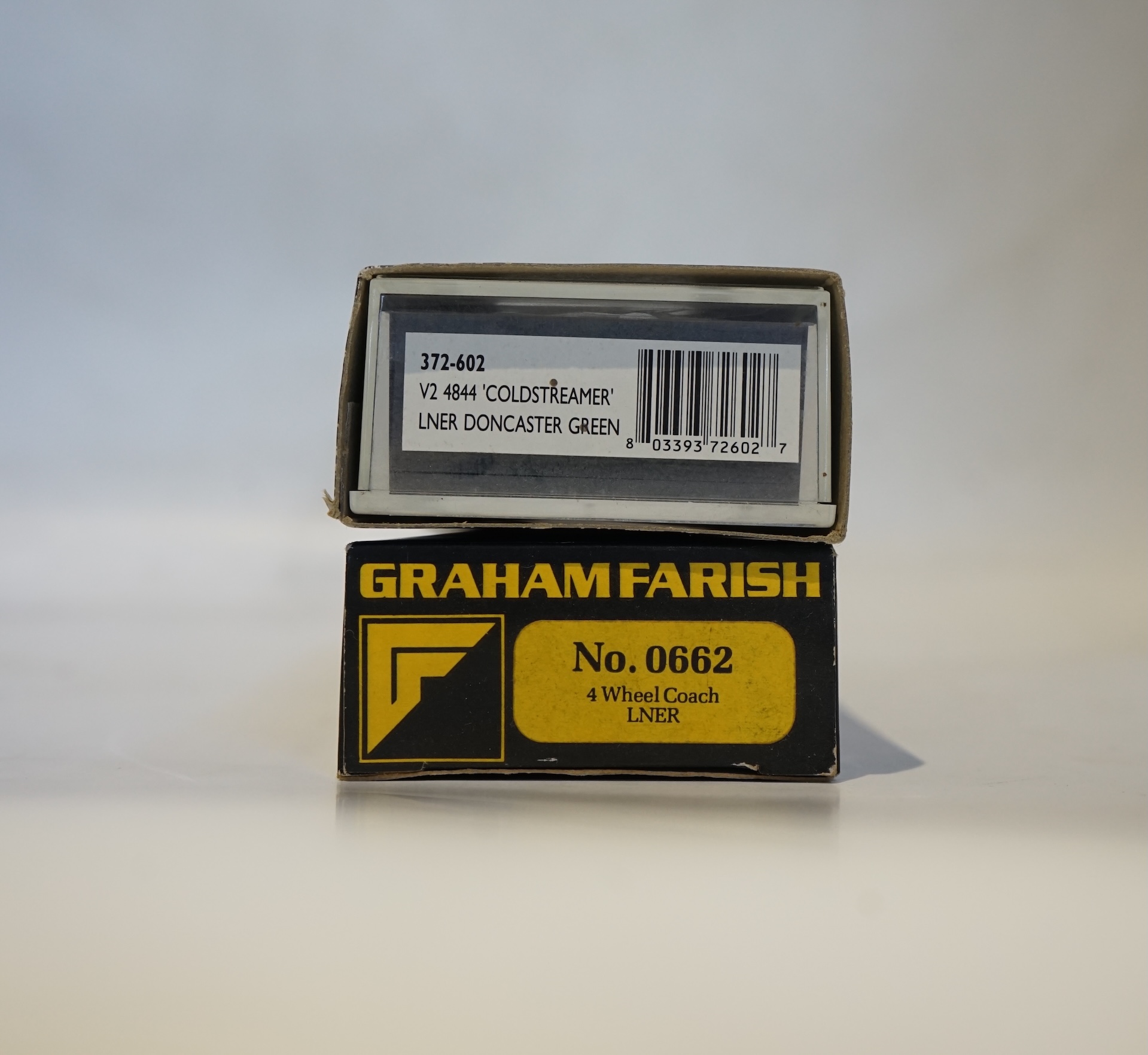 Twenty boxed Graham Farish N gauge railway; an LNER Class V2 2-6-2 tender locomotive, Coldstreamer, (372-602), together with nineteen LNER teak 4-wheel coaches. Condition - good.